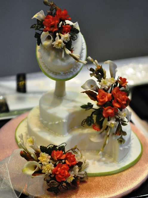 Miniature flowers on a tiny wedding cake